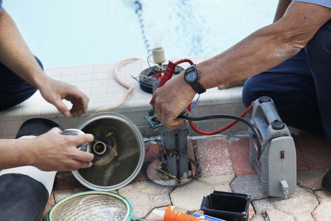 Men Working on Pool Repair