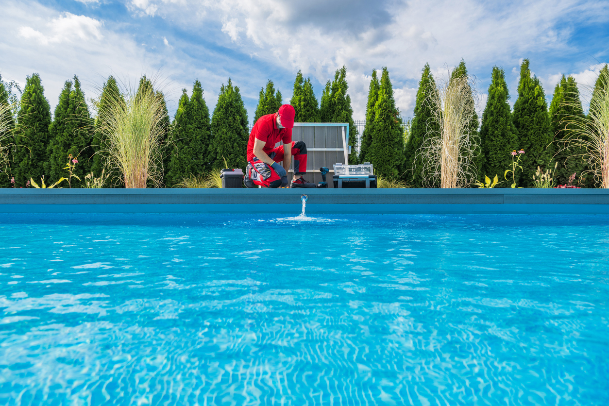 Technician Completing Pool Maintenance