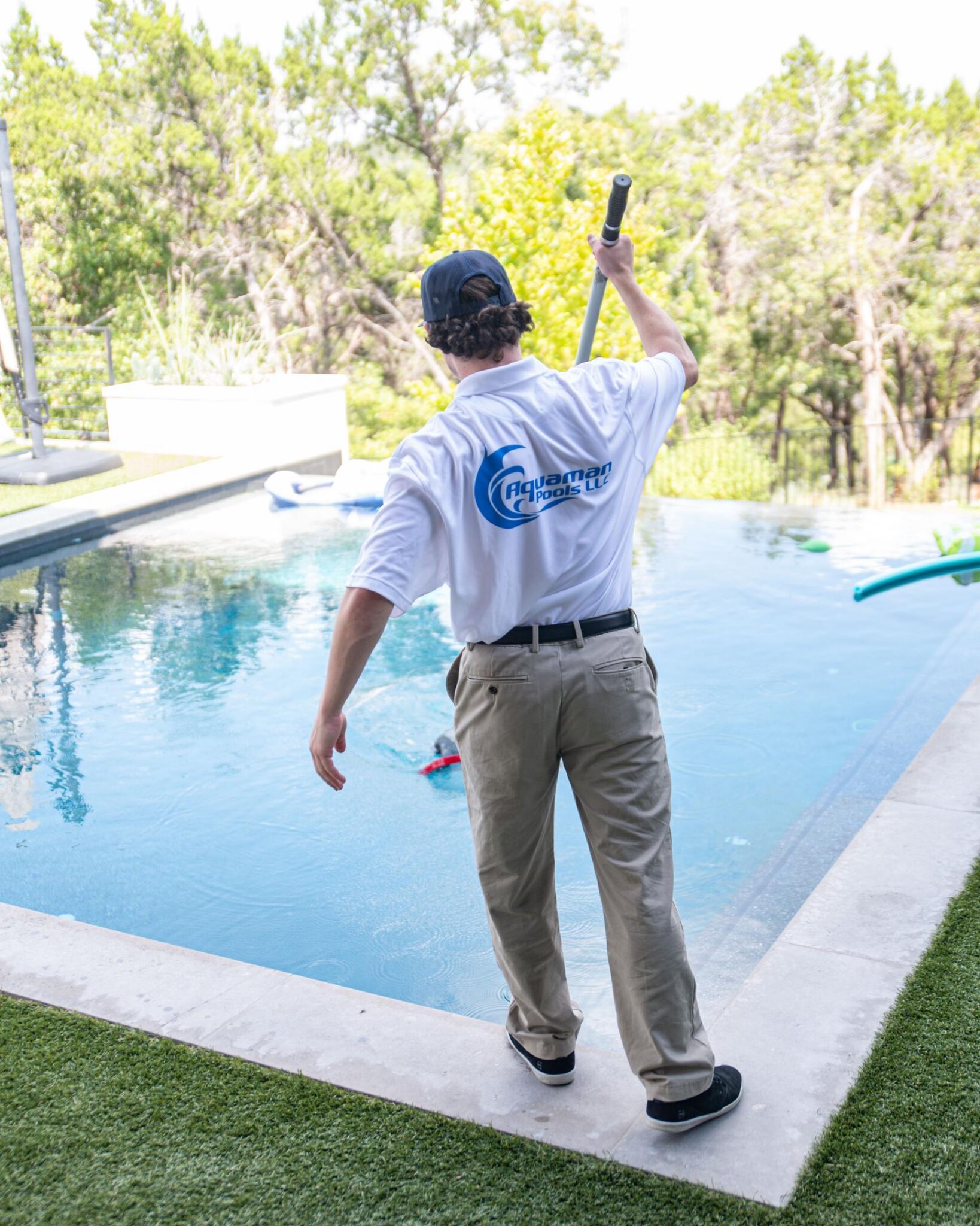 Aquaman pool tech cleaning pool.